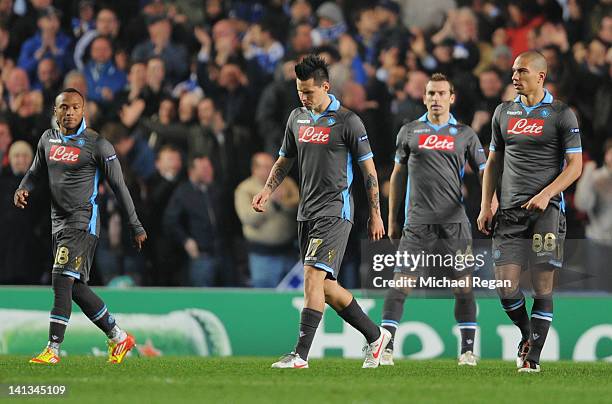 Camilo Zuniga, Marek Hamsik, Hugo Campagnaro andGokhan Inler of Napoli look dejected during the UEFA Champions League Round of 16 second leg match...