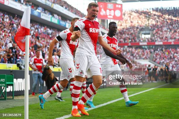 Luca Kilian of 1.FC Koeln celebrates after scoring their team's first goal during the Bundesliga match between 1. FC Köln and FC Schalke 04 at...