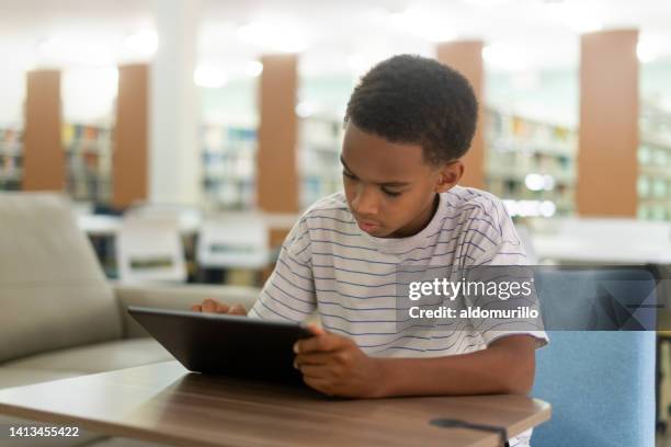 little boy using digital tablet - fish out of water stock pictures, royalty-free photos & images