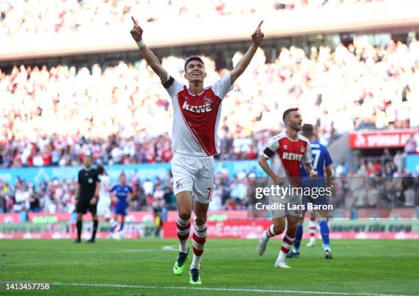 Dejan Ljubicic of 1.FC Koeln celebrates after scoring their team's third goal during the Bundesliga match between 1. FC Köln and FC Schalke 04 at...