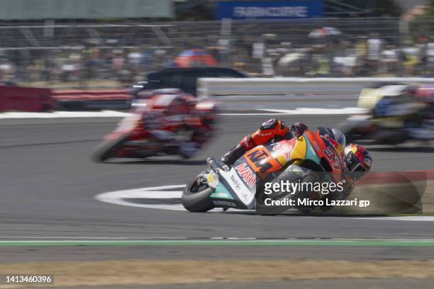 Augusto Fernandez of Spain and Red Bull KTM Team Ajo leads the field during the Moto2 race during the MotoGP of Great Britain - Race at Silverstone...
