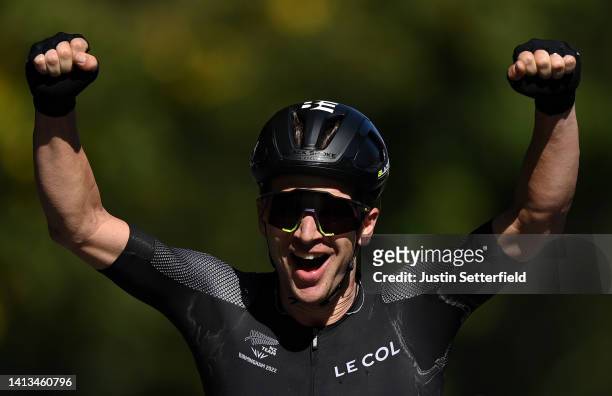 Aaron Gate of Team New Zealand celebrates winning Gold as they cross the finish line during the Men's Road Race on day ten of the Birmingham 2022...