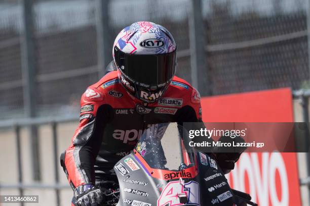 Aleix Espargaro of Spain and Aprilia Racing greets the fans during the MotoGP race during the MotoGP of Great Britain - Race at Silverstone Circuit...