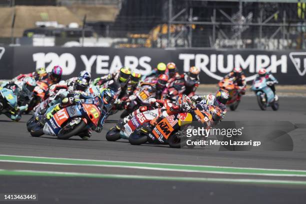 Deniz Oncu of Turkie and Red Bull Tech3 KTM leads the field during the Moto3 race during the MotoGP of Great Britain - Race at Silverstone Circuit on...