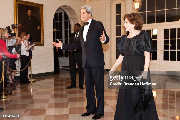Sen. John Kerry and Teresa Heinz Kerry arrive for a State Dinner in honor of British Prime Minister David Cameron at the White House on March 14,...