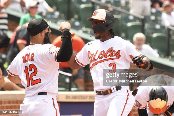 Jorge Mateo of the Baltimore Orioles celebrates a solo home run in the third inning with Rougned Odor during a baseball game against the Pittsburgh...