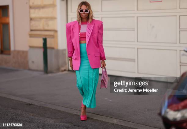 Karin Teigl wearing Zara red platform heels, Jacquemus Chiquito pink bag, Jacquemus checked pink and rose cropped top, Jacquemus blue colorful long...