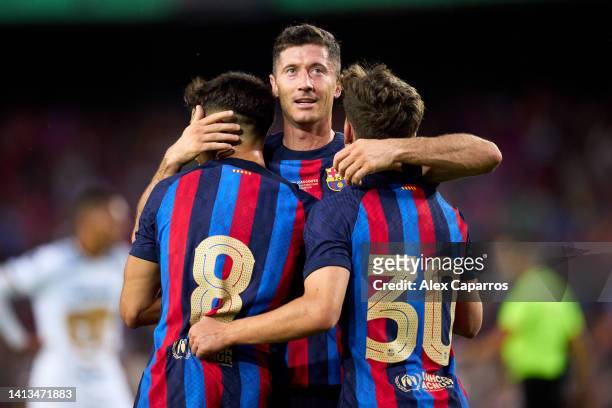 Robert Lewandowski of FC Barcelona celebrates with Pedro Gonzalez 'Pedri' and Pablo Martin 'Gavi' after Pedro Gonzalez 'Pedri' scored their team's...
