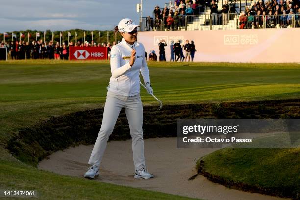 In Gee Chun of Korea Republic acknowledges the crowd playing her third shot on the 18th hole during Day Four of the AIG Women's Open at Muirfield on...
