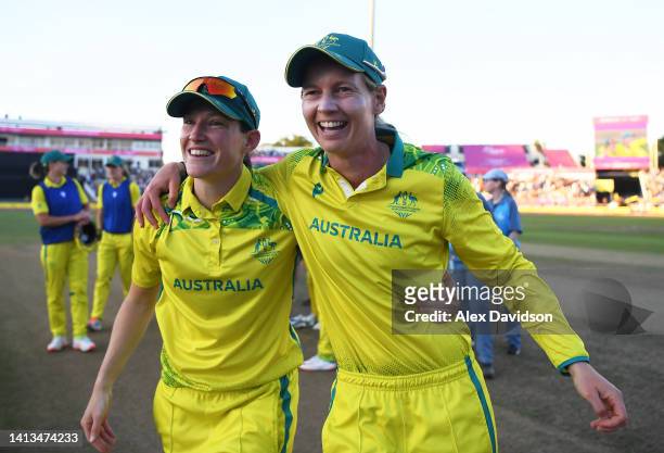 Megan Schutt and Meg Lanning of Team Australia celebrate after winning the gold medal following the Cricket T20 - Gold Medal match between Team...