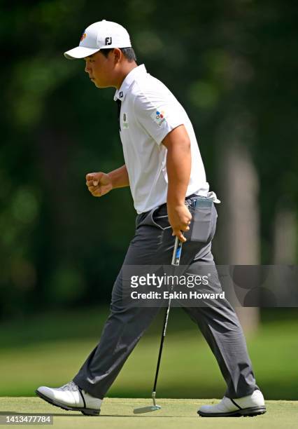 Joohyung Kim of Korea celebrates after his birdie on the ninth hole during the final round of the Wyndham Championship at Sedgefield Country Club on...