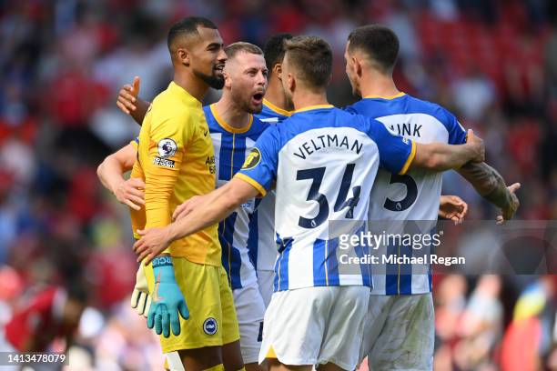 Robert Sanchez, Adam Webster, Joel Veltman and Lewis Dunk of Brighton celebrate after the Premier League match between Manchester United and Brighton...