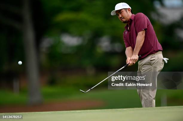 John Huh of the United States chips on the ninth green during the final round of the Wyndham Championship at Sedgefield Country Club on August 07,...