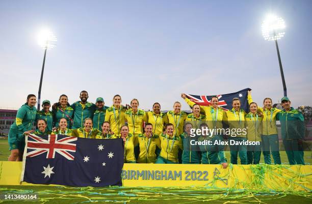 Team Australia pose for a photo after being presented with a Gold Medal during the Cricket T20 - Gold Medal match between Team Australia and Team...