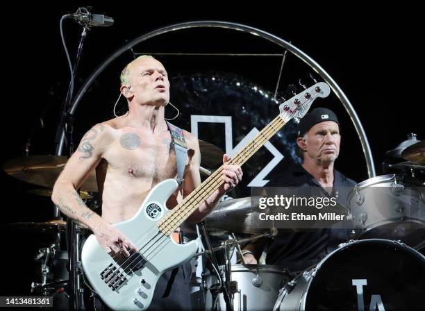 Bassist Flea and drummer Chad Smith of Red Hot Chili Peppers perform at Allegiant Stadium on August 06, 2022 in Las Vegas, Nevada.