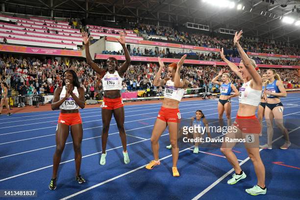 Ama Pipi, Victoria Ohuruogu, Jodie Williams and Jessie Knight of Team England celebrate winning the gold medal in the Women's 4 x 400m Relay - Final,...