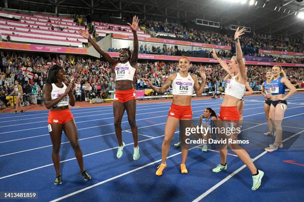 Ama Pipi, Victoria Ohuruogu, Jodie Williams and Jessie Knight of Team England celebrate winning the gold medal in the Women's 4 x 400m Relay - Final,...