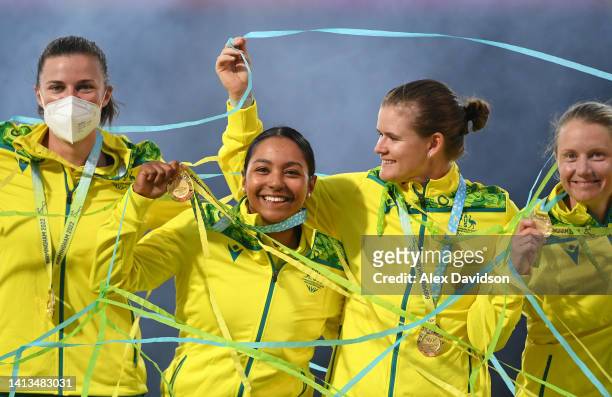 Tahlia McGrath, Alana King, Jess Jonassen and Alyssa Healy of Team Australia pose with their Gold Medal following the Cricket T20 - Gold Medal match...