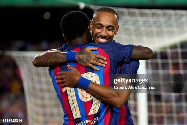 Pierre-Emerick Aubameyang of FC Barcelona celebrates with Franck Kessie after scoring his team's fifth goal during the Joan Gamper Trophy match...