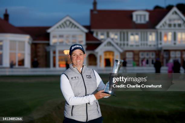 Ashleigh Buhai of South Africa poses with the AIG Women's Open trophy on the eighteenth green after winning the play-off to become the 2022 AIG...