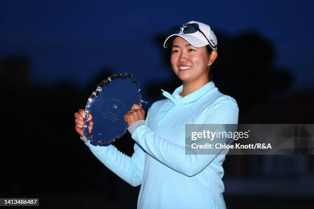 The Leading Amateur, Rose Zhang of the United States poses with their trophy on the 18th green during Day Four of the AIG Women's Open at Muirfield...