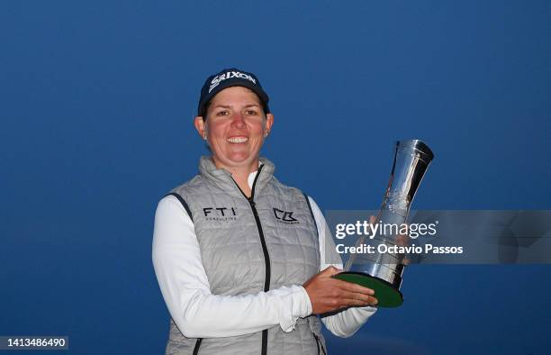 Ashleigh Buhai of South Africa poses with the AIG Women's Open trophy on the eighteenth green after winning the play-off to become the 2022 AIG...