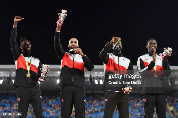 Gold medalists Team Trinidad And Tobago pose for a photo during the medal ceremony for the Men's 4 x 400m Relay - Final on day ten of the Birmingham...