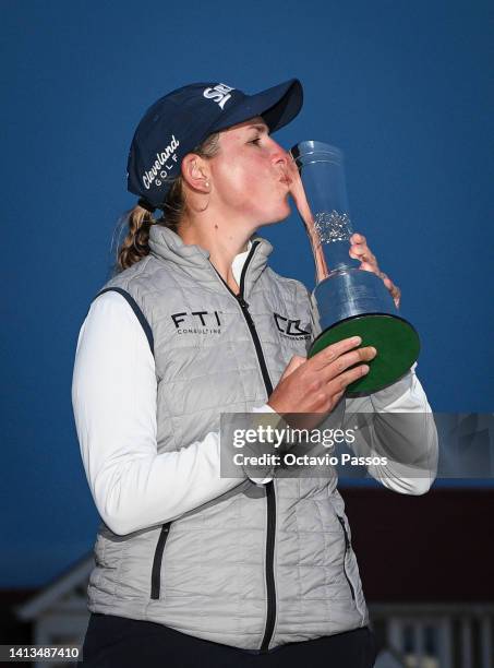 Ashleigh Buhai of South Africa poses with the AIG Women's Open trophy on the eighteenth green after winning the play-off to become the 2022 AIG...