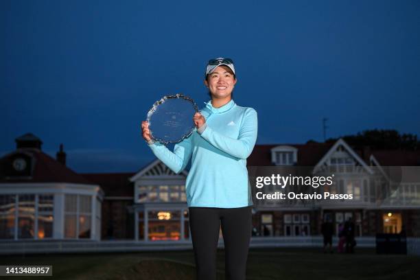 Rose Zhang of United States aposes with the trophy as best amateur player during Day Four of the AIG Women's Open at Muirfield on August 07, 2022 in...