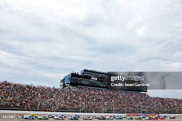 Bubba Wallace, driver of the McDonald's Toyota, leads the field the field to start the NASCAR Cup Series FireKeepers Casino 400 at Michigan...