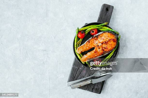 grilled salmon steak and asparagus ready-to-eat - baked salmon stock pictures, royalty-free photos & images