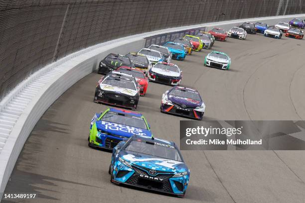 Martin Truex Jr., driver of the Auto-Owners Insurance Toyota, leads the field during the NASCAR Cup Series FireKeepers Casino 400 at Michigan...