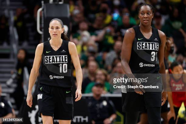 Sue Bird and Tina Charles of the Seattle Storm walk together during the fourth quarter against the Las Vegas Aces at Climate Pledge Arena on August...