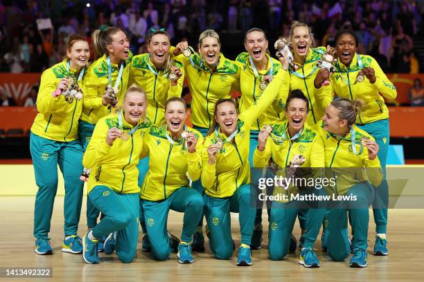 Gold Medallists Team Australia celebrate during the Netball Medal Ceremony on day ten of the Birmingham 2022 Commonwealth Games at NEC Arena on...