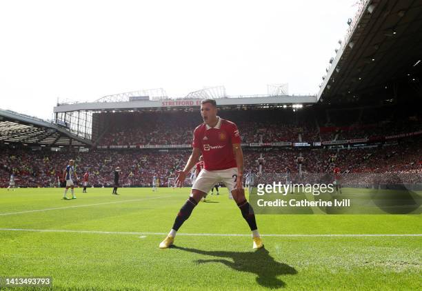 General view as Diogo Dalot urges on the fans during the Premier League match between Manchester United and Brighton & Hove Albion at Old Trafford on...