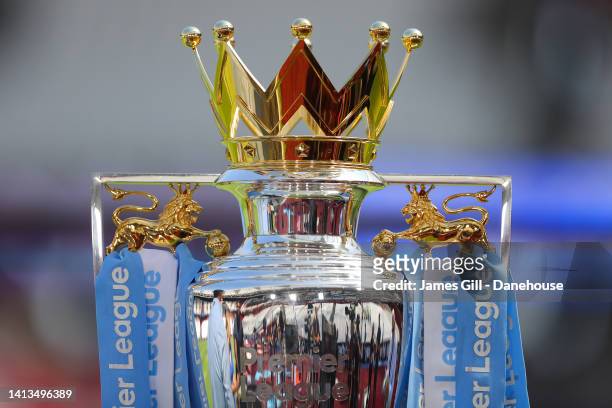 Detailed view of the Premier League trophy is seen prior to the Premier League match between West Ham United and Manchester City at London Stadium on...
