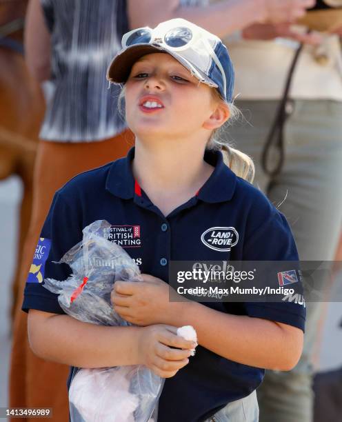 Mia Tindall seen eating a bag of candy floss as she attends day 3 of the 2022 Festival of British Eventing at Gatcombe Park on August 7, 2022 in...