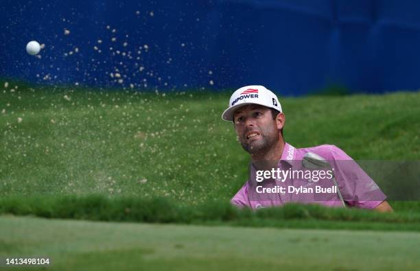 Robert Streb of the United States plays a shot from a bunker on the 18th hole during the final round of the Wyndham Championship at Sedgefield...