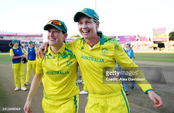 Megan Schutt and Meg Lanning of Team Australia celebrate after winning the gold medal following the Cricket T20 - Gold Medal match between Team...