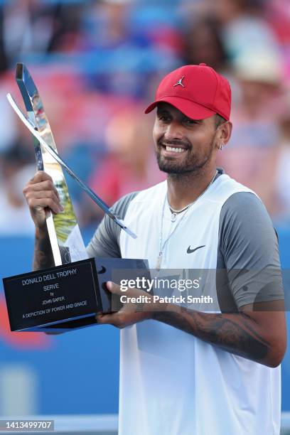 Nick Kyrgios of Australia celebrates with the Donald Dell Trophy after defeating Yoshihito Nishioka of Japan in their Men's Singles Final match...