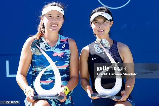 Zhaoxuan Yang of China and Yifan Xu of China pose with their trophies after defeating Hao-Ching Chan and Shuko Aoyama of Japan in the doubles finale...