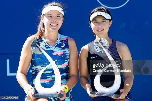 Zhaoxuan Yang of China and Yifan Xu of China pose with their trophies after defeating Hao-Ching Chan and Shuko Aoyama of Japan in the doubles finale...