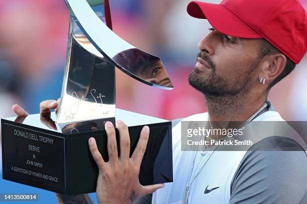Nick Kyrgios of Australia celebrates with the Donald Dell Trophy after defeating Yoshihito Nishioka of Japan in their Men's Singles Final match...