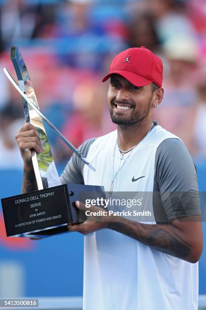 Nick Kyrgios of Australia celebrates with the Donald Dell Trophy after defeating Yoshihito Nishioka of Japan in their Men's Singles Final match...