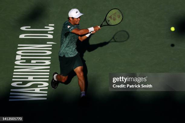 Yoshihito Nishioka of Japan returns a shot to Nick Kyrgios of Australia in their Men's Singles Final match during Day 9 of the Citi Open at Rock...