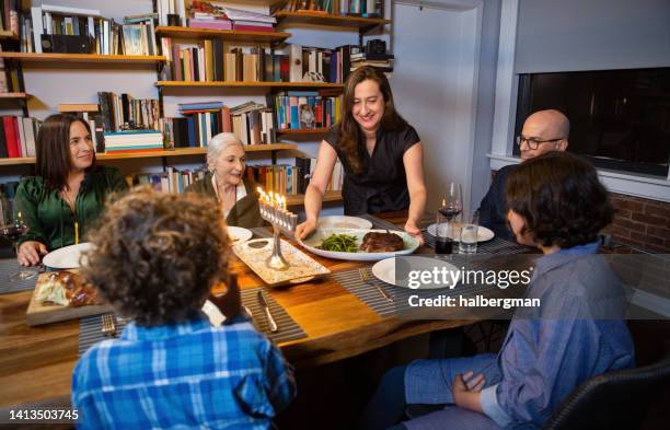 hanukkah dinner being served - kosher stock pictures, royalty-free photos & images