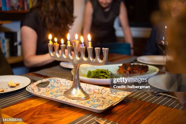 nearly melted hanukkah candles - chanoeka stockfoto's en -beelden