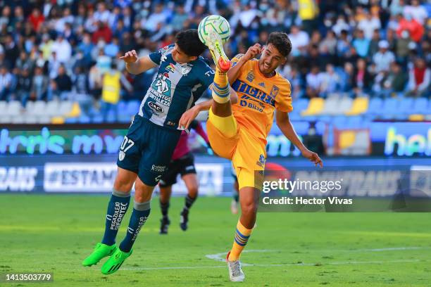 Nicolas Ibañez of Pachuca fights for the ball with Diego Reyes of Tigres during the 7th round match between Pachuca and Tigres UANL as part of the...