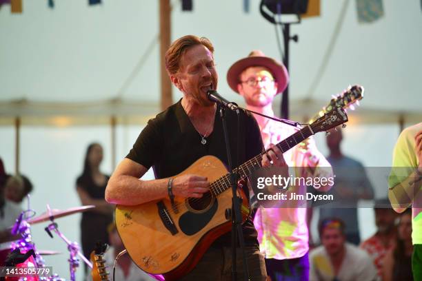Actor and musician Damian Lewis performs on stage during the Wilderness Festival at Cornbury Park on August 07, 2022 in Charlbury, United Kingdom.