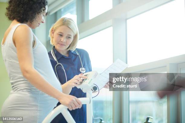 pre natal checks - midwife stock pictures, royalty-free photos & images